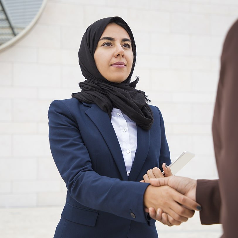 confident-business-lady-meeting-thanking-colleague-outside-min